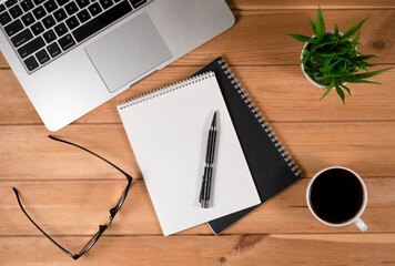 Laptop, Notebook and Office Supply Items on Wooden Work Desk