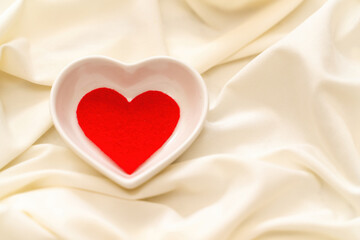 Red heart on a white background. Valentine's day concept, love, family.