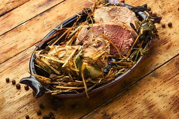 Pork baked in herbs.