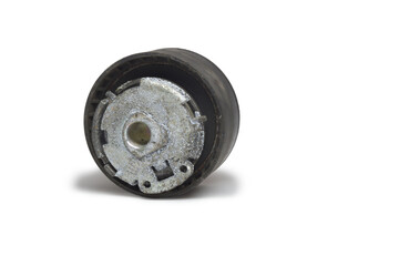 timing belt tensioner roller, threadbare, with white cover of corrosion flakes. Part of car timing mechanism, dismantled for replacing. isolated on white background, with clipping path