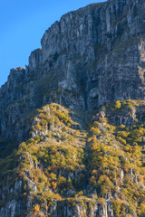 view of towers of Astraka above Papigo stone village ,during fall season in epirus  Greece