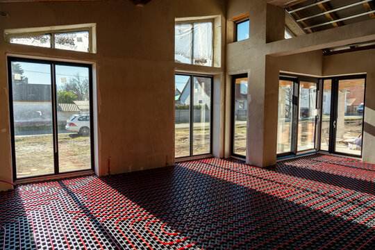 fllor heating in the house under construction with windows and light