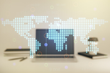 Naklejka premium Multi exposure of abstract creative digital world map on laptop background, research and analytics concept