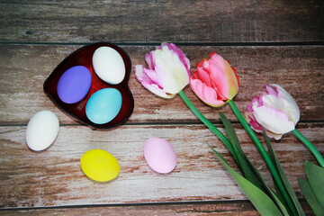 colorful Easter eggs and pink tulips