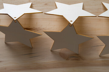 wooden star ornaments or shapes on wood