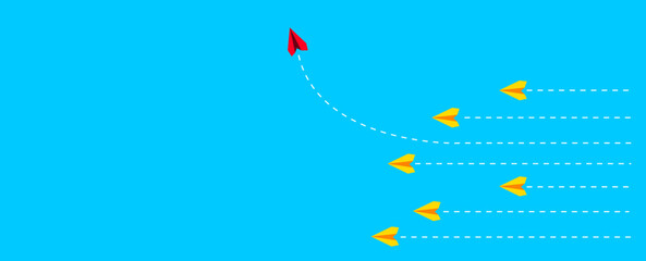 red plane changing direction on blue background.yellow planes flying straight.concept of change, unique, trend, courage, innovation, difference.
different ideas and different thoughts.