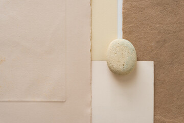 isolated stone and old art paper
