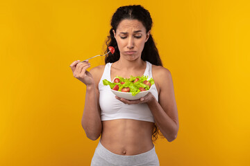 Portrait of Sad Lady Holding Plate With Vegetable Salad