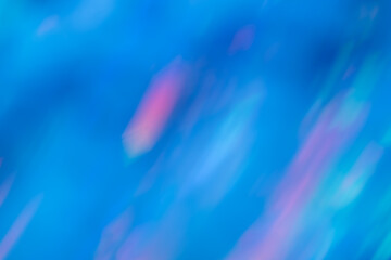 Blur blue rainbow abstract background from the sun shines on the silicon wafer.