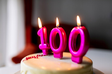 Cake with candles with number 100
