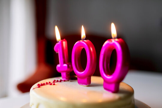 Cake with candles with number 100