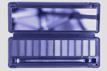 Trendy very peri color of the year 2022, violet open eye shadow palette with mirror and brush