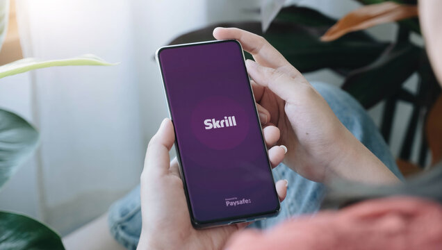 Chaing Mai, Thailand  - 01 FEB 2022: Skrill mobile app logo on phone screen, close-up icon, Illustrative Editorial.