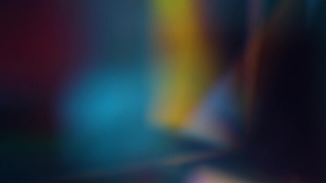 abstract blurred movement of multicolored light reflection of background colors
