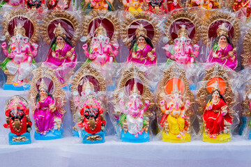 Colourful clay idols of Goddess Laxmi and God Ganesha. Displayed for sale at Kalighat, West Bengal, India