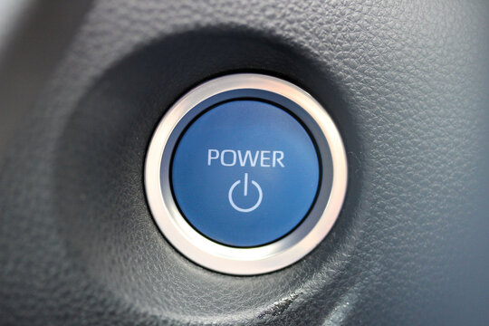 Blue power button in a new hybrid vehicle