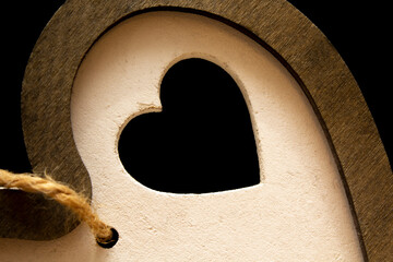 Wooden heart on black background. Love valentine concept