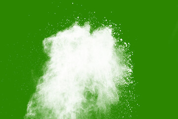 Explosion of white powder isolated on green background. Abstract colored background. holi festival.