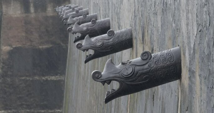 Rain in Forbidden City. Dragon water spout