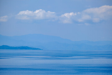 Lake, clouds and mountains