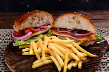 Big hamburger, French fries and vegetables
