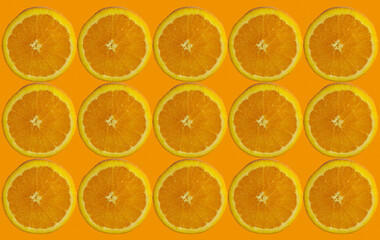 Orange slices pattern on isolated orange color background