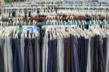 Second hand clothes and pants with quality brands imported from abroad are sold on the roadside at...
