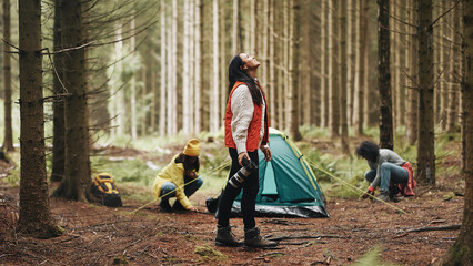 Woman taking photos at her campsite