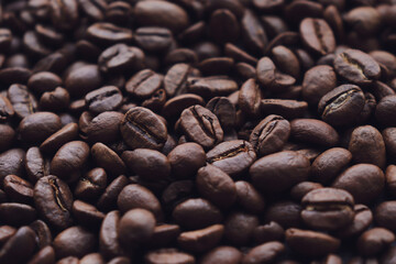 Сoffee beans of different sizes closeup