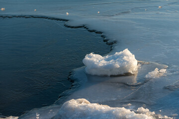 ice forms on the surface of the lake © eugen