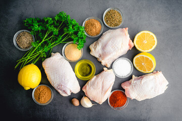Olive Oil Chicken Thighs Mediterranean Style Ingredients: Raw chicken thighs with olive oil, lemon, herbs, and spices 