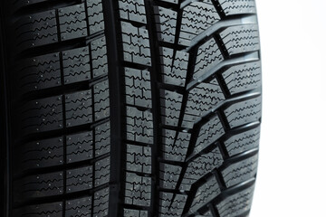 Pattern of tires in close up isolated on white background. wheel cut out. Structured rubber on automobile in detail. Textured wheels shot in studio. © WildMedia