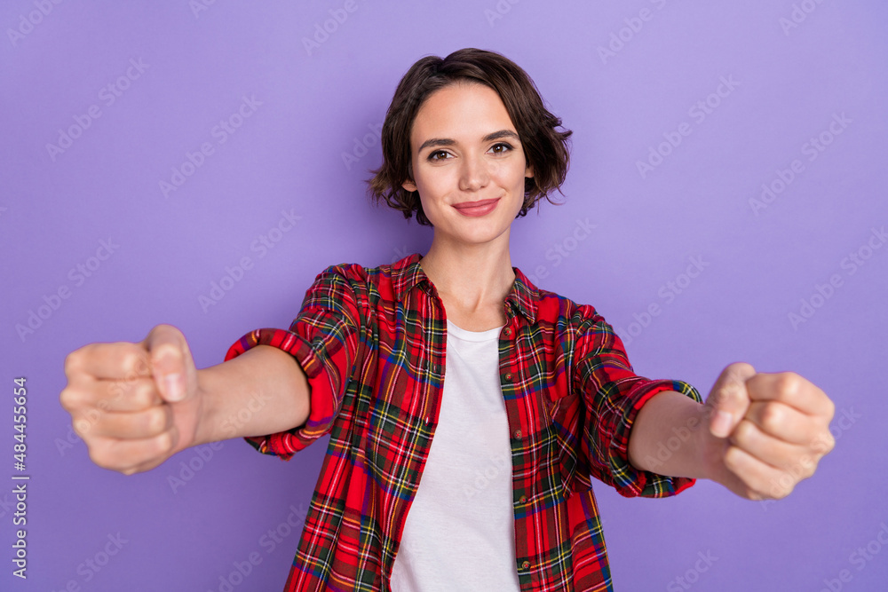 Wall mural photo of sweet young brunette lady drive car wear red shirt isolated on purple color background