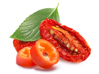 Dried or Sundried tomato halves with chile pepper and basil  isolated - obrazy, fototapety, plakaty