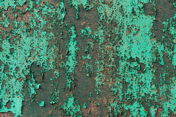 Abstract closeup of peeling paint on a metal surface