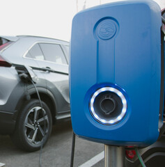 Power supply for electric car charging. Electric car charging station. EV Car battery charger at charge station electro mobilit. Environment friendly Car. 