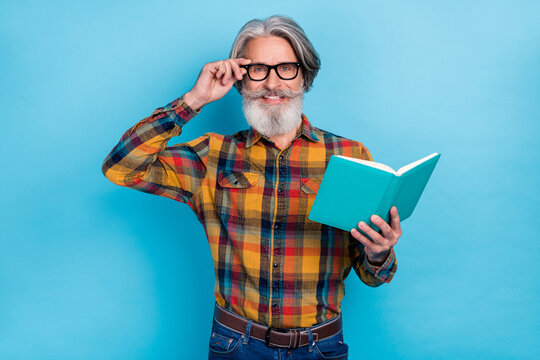 Photo of attractive man wear plaid shirt arm spectacles enjoying good story isolated blue color background