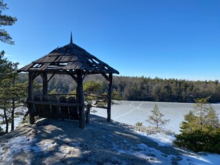winter in the mountains, shed overlooking frozen lake