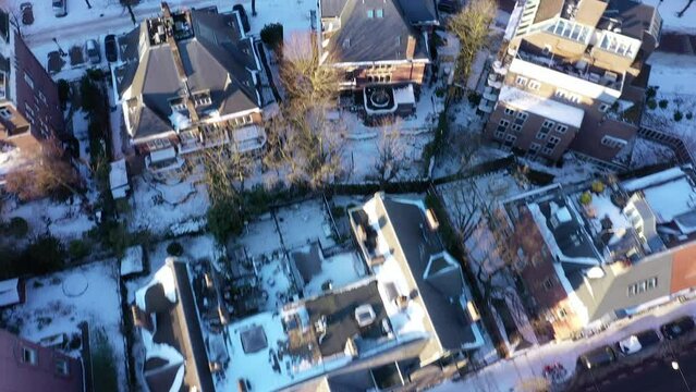 Aerial of snow covered, upscale neighborhood. Amsterdam, Netherlands.