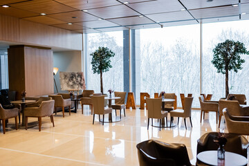 restaurant in spacious lounge of modern hotel.