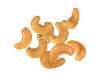 Tasty roasted cashew nuts falling on white background