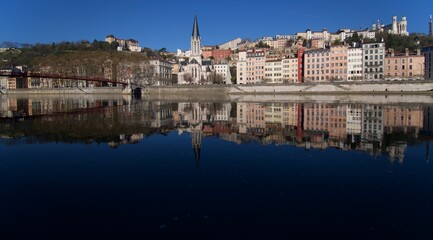 Obraz premium Panorama of old lyon in France with in the foreground the river Saone with church Saint George, and basilica Notre Dame de fourviere.