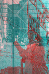 Double exposure. Successful woman near futuristic glass business center