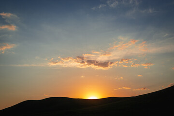 The sun went down over the mountain.