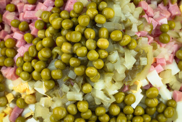 Green peas, onions, chopped sausage. Salad ingredients.