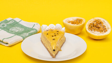 Passion fruit cheesecake, on a yellow background