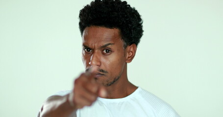 Upset African man pointing finger arguing. Black man in argument gesturing blaming