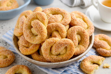 Sugar  cottage cheese  pretzels  in a plate. Curd cookies for breakfast.  Healthy dessert. Selective focus. 