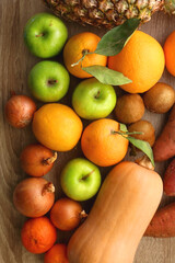 Various healthy fruit and vegetable on wooden background. Top view.