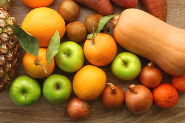 Various healthy fruit and vegetable on wooden background. Top view.